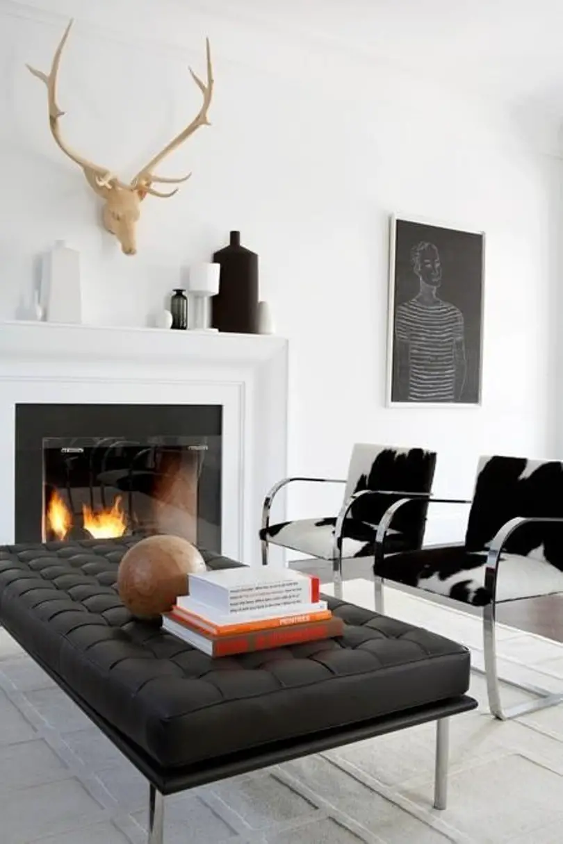 An Elegant Minimalist Living Room With A Fireplace