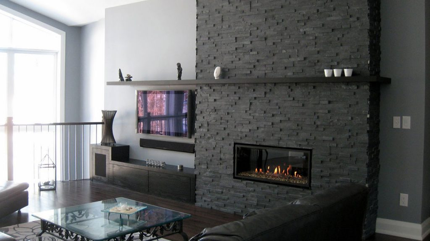 The Natural Gray Stone Fireplace Around The Furnace Has A Clean And Beautiful Appearance Creating A Geometrical Impression On The Room. 